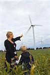 Mother and Son Looking at Wind Turbines, Denmark