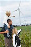 Father and Children Looking at Wind Turbines, Denmark