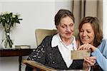 Mother and Daughter Looking at Photo Album