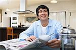 Man Eating Breakfast, Reading Newspaper