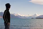 Man Looking over Lake and Mountains, Lake Pukaki, Mount Cook, Canterbury, New Zealand
