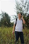 Man talking on mobile phone, hiking, outdoors