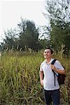 Man hiking outdoors, in woods, forest