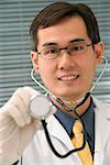 Doctor with stethoscope smiling at camera