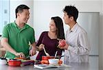 Friends cooking in the kitchen