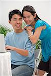 Young couple smiling at camera