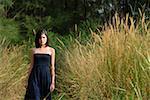 Woman walking in long grass