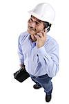 Mature man wearing construction hat, using mobile phone, looking away