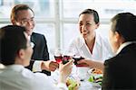 Executives toasting with wine