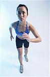 Woman in running position, facing forward