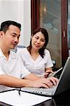 Couple looking at laptop