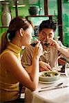 Couple in Chinese restaurant, drinking wine
