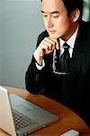 Businessman looking at laptop, high angle view