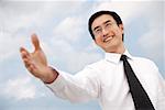 Businessman with hand outstretched
