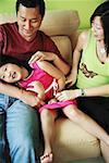 Family with one child, tickling daughter