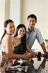 Young adults in restaurant, looking at camera