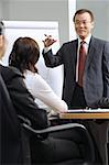 Businessman giving presentation colleagues