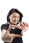 Young woman making hand sign