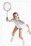 Young woman holding badminton racket