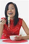 Woman eating noodles