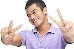Man smiling, making peace hand sign