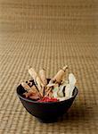 Bowl filled with Chinese medicinal herbs, still life