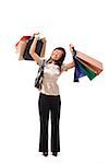 Woman carrying many shopping bags