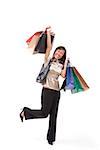 Woman carrying shopping bags, arms outstretched