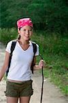 Female hiker smiling at camera, portrait