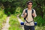 Young man hiking in the wilderness