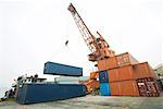 Crane picking up cargo container