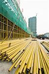 Construction site, metal beams on ground