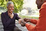 Man Proposing to Woman in City Park, New York City, New York, USA