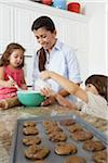 Mother and Children Baking Cookies