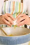 Woman Cracking Eggs