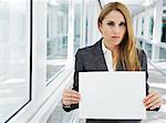 Businesswoman Holding Blank Piece of Paper