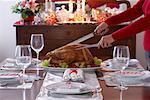 Woman Carving Christmas Turkey