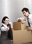 Business people in office with boxes