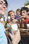 Teenagers hanging out, eating