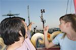Teenage couple on Ferris wheel in amusement park