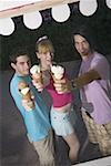 Teenagers posing with ice cream