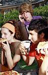 Teenagers hanging out, eating