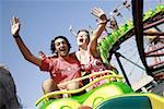 Teenage couple on amusement park ride