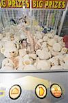 Female teenager among teddy bears in arcade