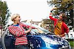 Couple Washing Car, Play Fighting