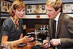 Couple with Cell Phones in Cafe