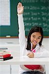 Girl raising hand in class