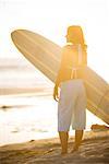 Surfer Standing on the Beach, Newport Beach, Orange County, California, USA