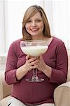 Pregnant Woman Drinking Large Glass of Milk