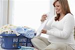 Pregnant Woman Doing Laundry